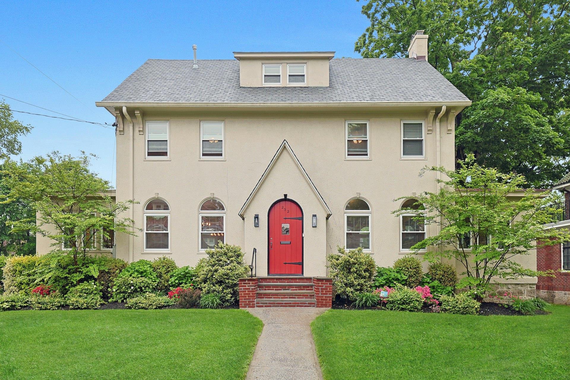 a front view of a house with garden