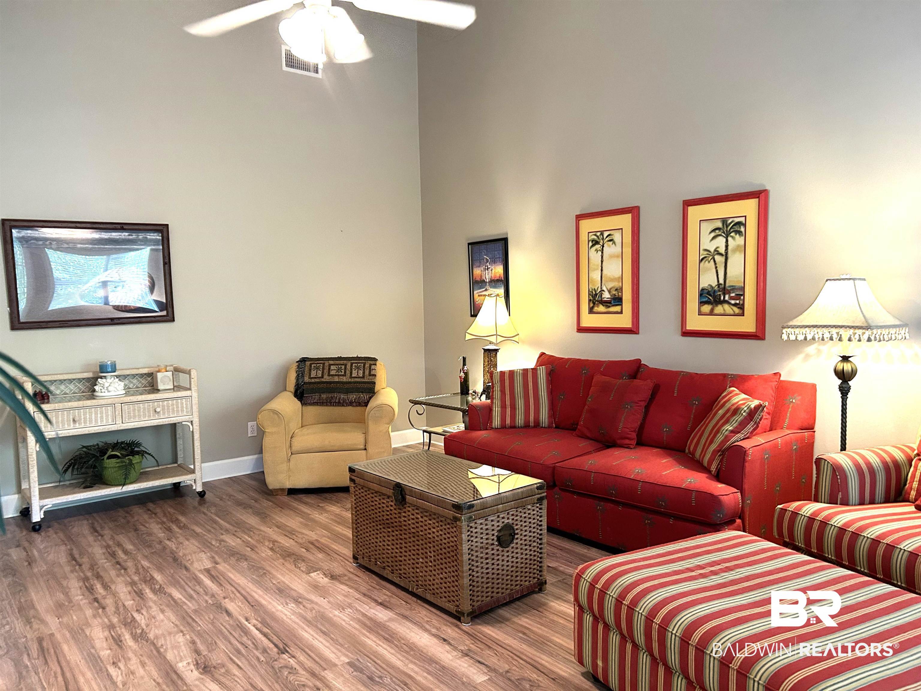 430 West Fort Morgan Road, Unit 404 Gulf Shores, AL 36542 - Photo 10 of 31 Living room with wood-type flooring and ceiling fan