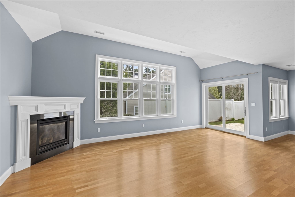 10 Mariner's Drive, Unit 10 Marshfield, MA 02050 - Photo 16 of 25 a view of an empty room with a fireplace and a window