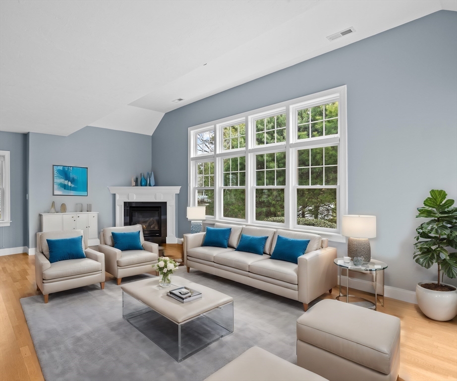 10 Mariner's Drive, Unit 10 Marshfield, MA 02050 - Photo 3 of 25 a living room with furniture and a fireplace