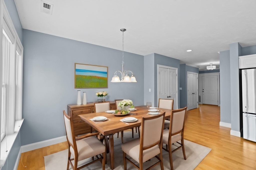 10 Mariner's Drive, Unit 10 Marshfield, MA 02050 - Photo 5 of 25 a view of a dining room with furniture and wooden floor