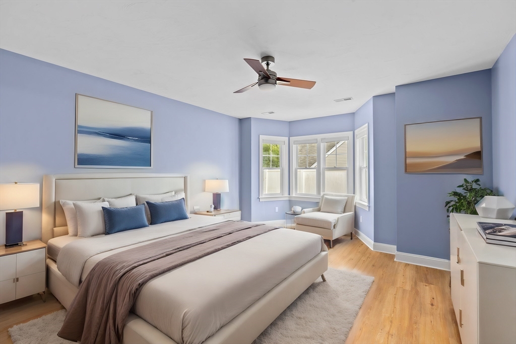 10 Mariner's Drive, Unit 10 Marshfield, MA 02050 - Photo 7 of 25 a bedroom with a bed and a chandelier