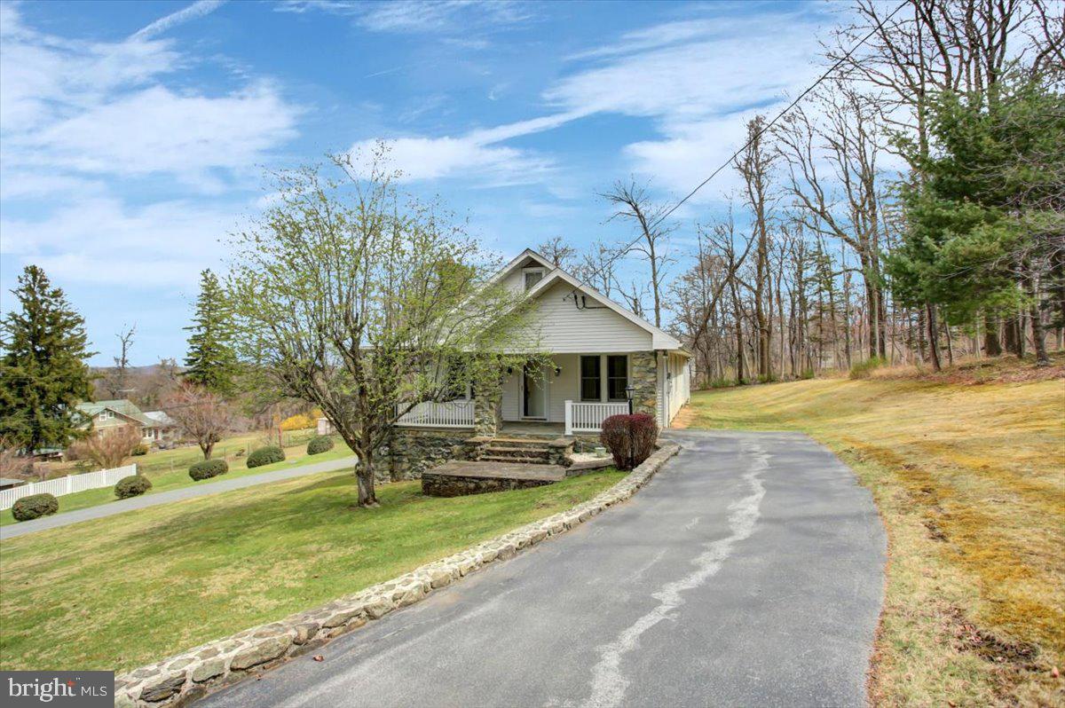 14625 Hilltop Road Cascade, MD 21719 - Photo 11 of 49 a front view of a house with a yard