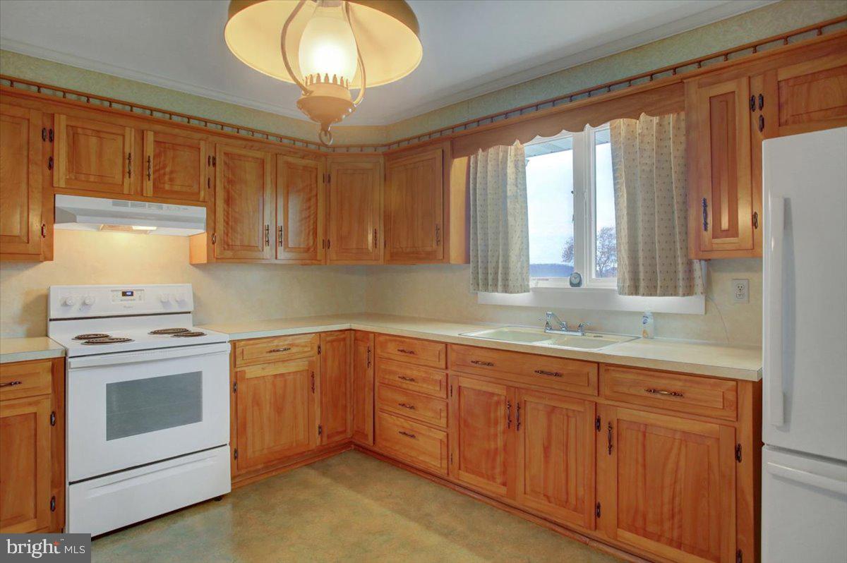 14625 Hilltop Road Cascade, MD 21719 - Photo 16 of 49 a kitchen with sink and cabinets