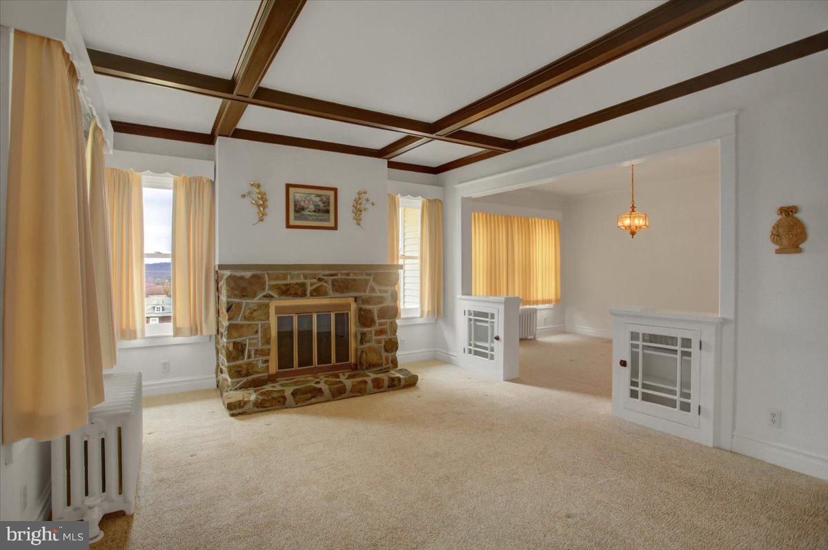 14625 Hilltop Road Cascade, MD 21719 - Photo 18 of 49 a living room with furniture and a fireplace