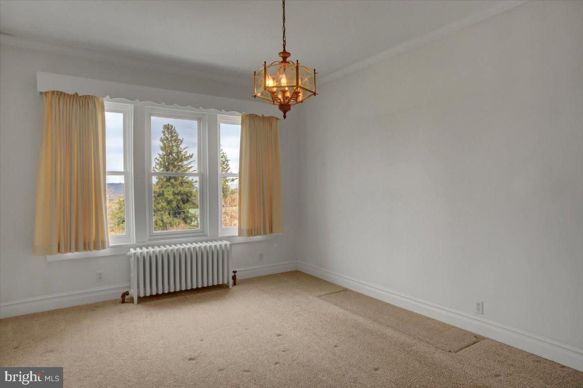 14625 Hilltop Road Cascade, MD 21719 - Photo 21 of 49 a view of an empty room with a window