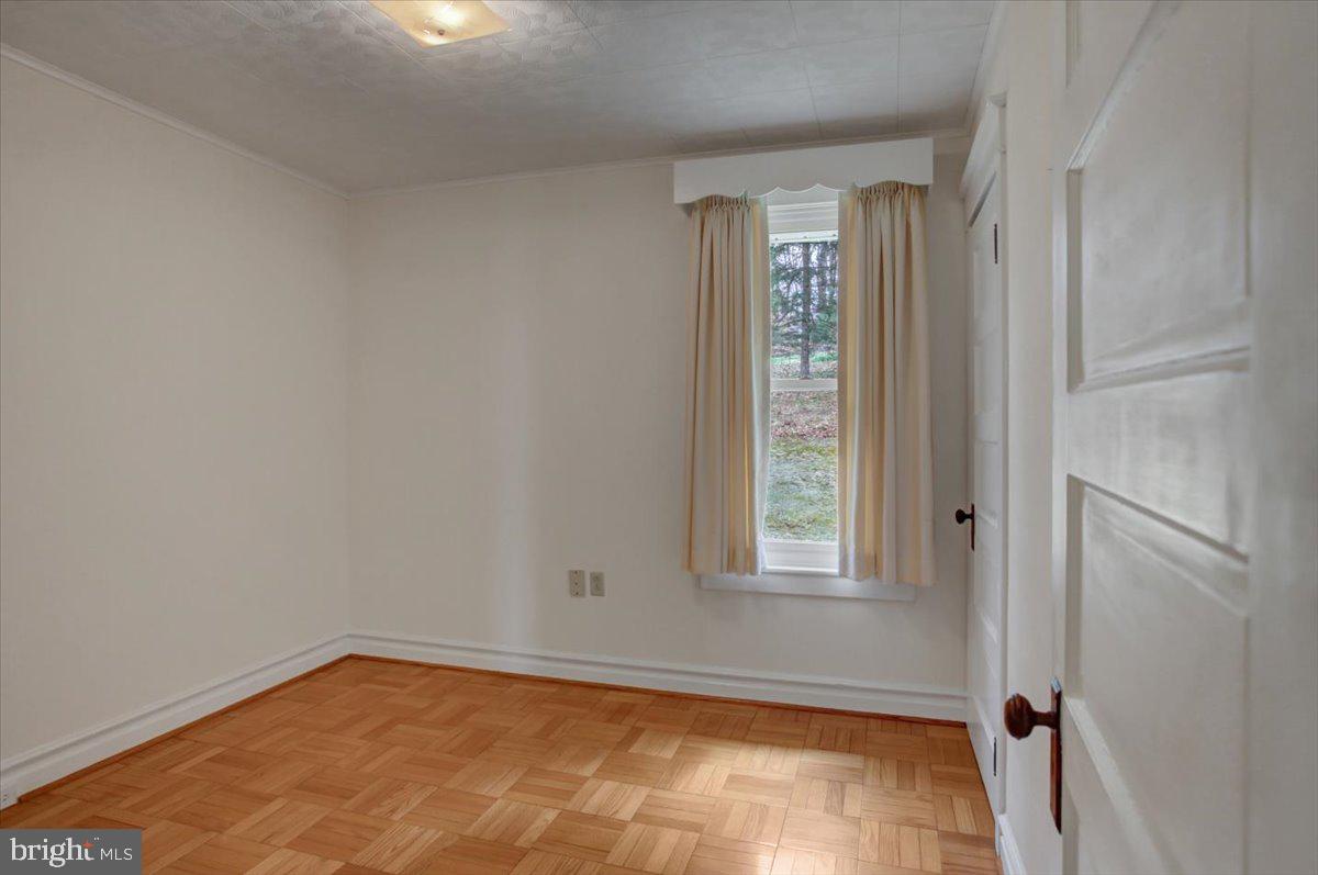 14625 Hilltop Road Cascade, MD 21719 - Photo 29 of 49 a view of an empty room and window
