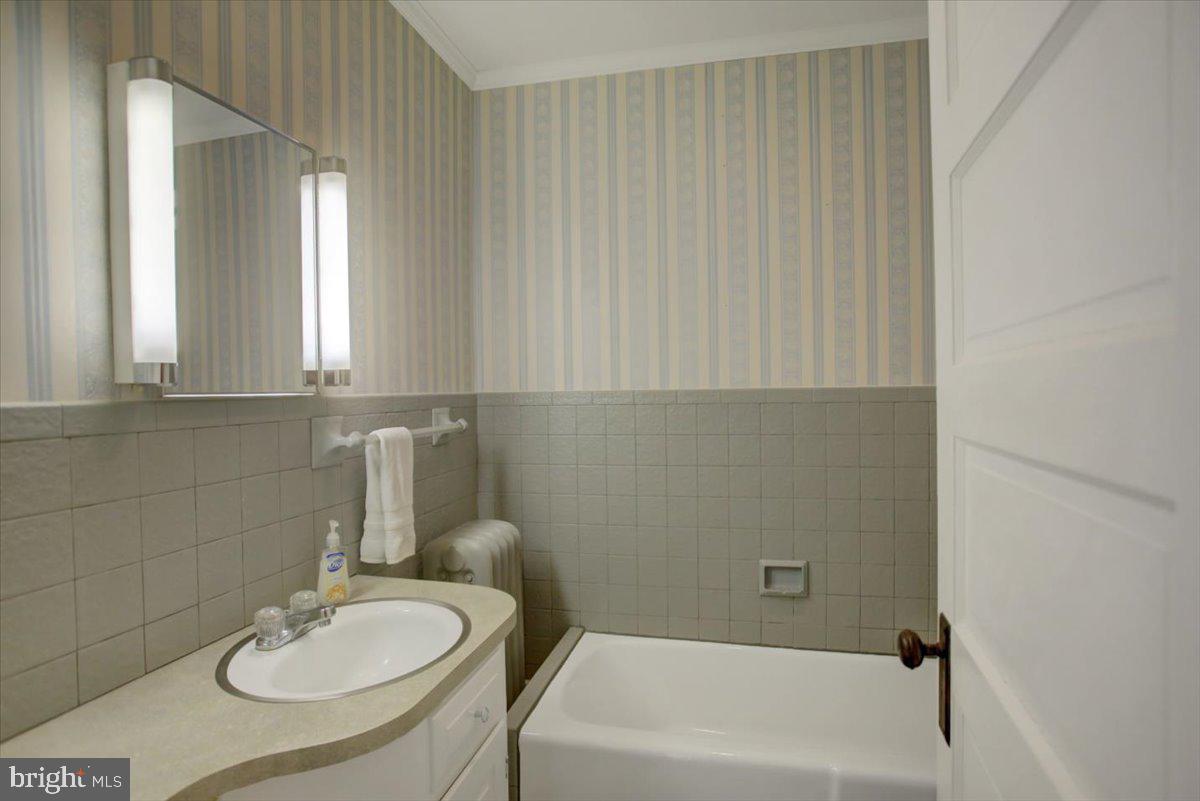 14625 Hilltop Road Cascade, MD 21719 - Photo 33 of 49 a bathroom with a sink and a mirror