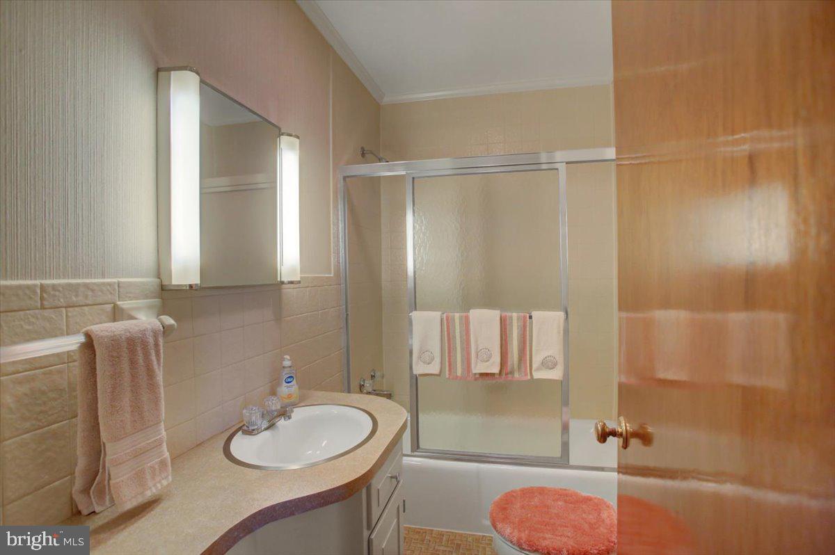 14625 Hilltop Road Cascade, MD 21719 - Photo 34 of 49 a bathroom with a sink toilet and shower