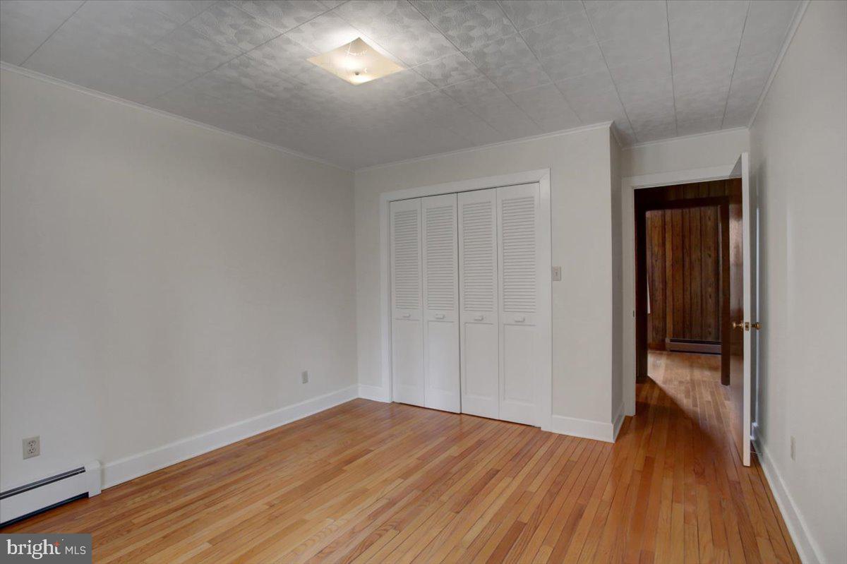 14625 Hilltop Road Cascade, MD 21719 - Photo 36 of 49 wooden floor in an empty room
