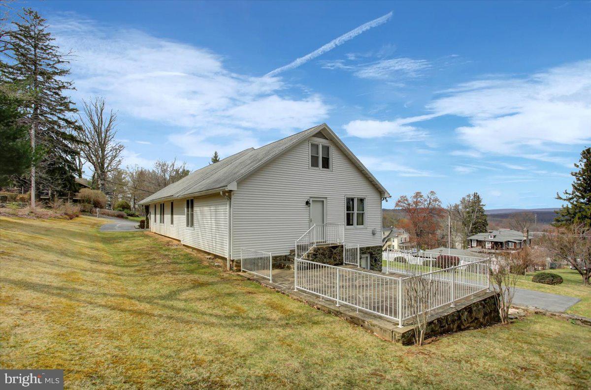 14625 Hilltop Road Cascade, MD 21719 - Photo 9 of 49 a view of a house with a patio