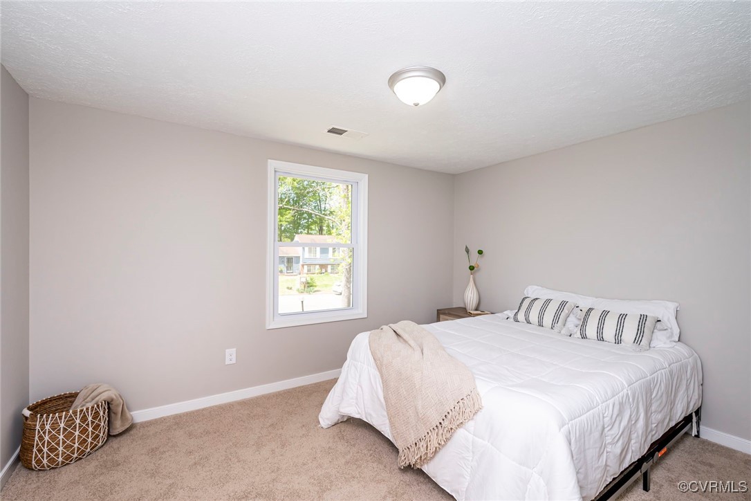 2821 Remington Road Henrico, VA 23231 - Photo 11 of 24 a bedroom with a bed and a window