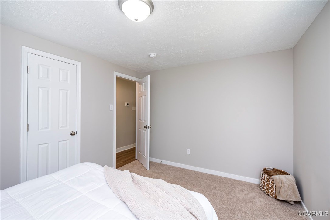 2821 Remington Road Henrico, VA 23231 - Photo 12 of 24 a bedroom with a bed and a cabinets