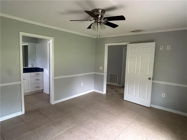 a view of an empty room with a bathroom