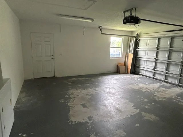 a view of empty room with windows