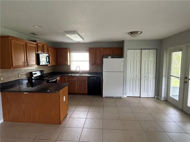 a kitchen with a cabinets and counter space