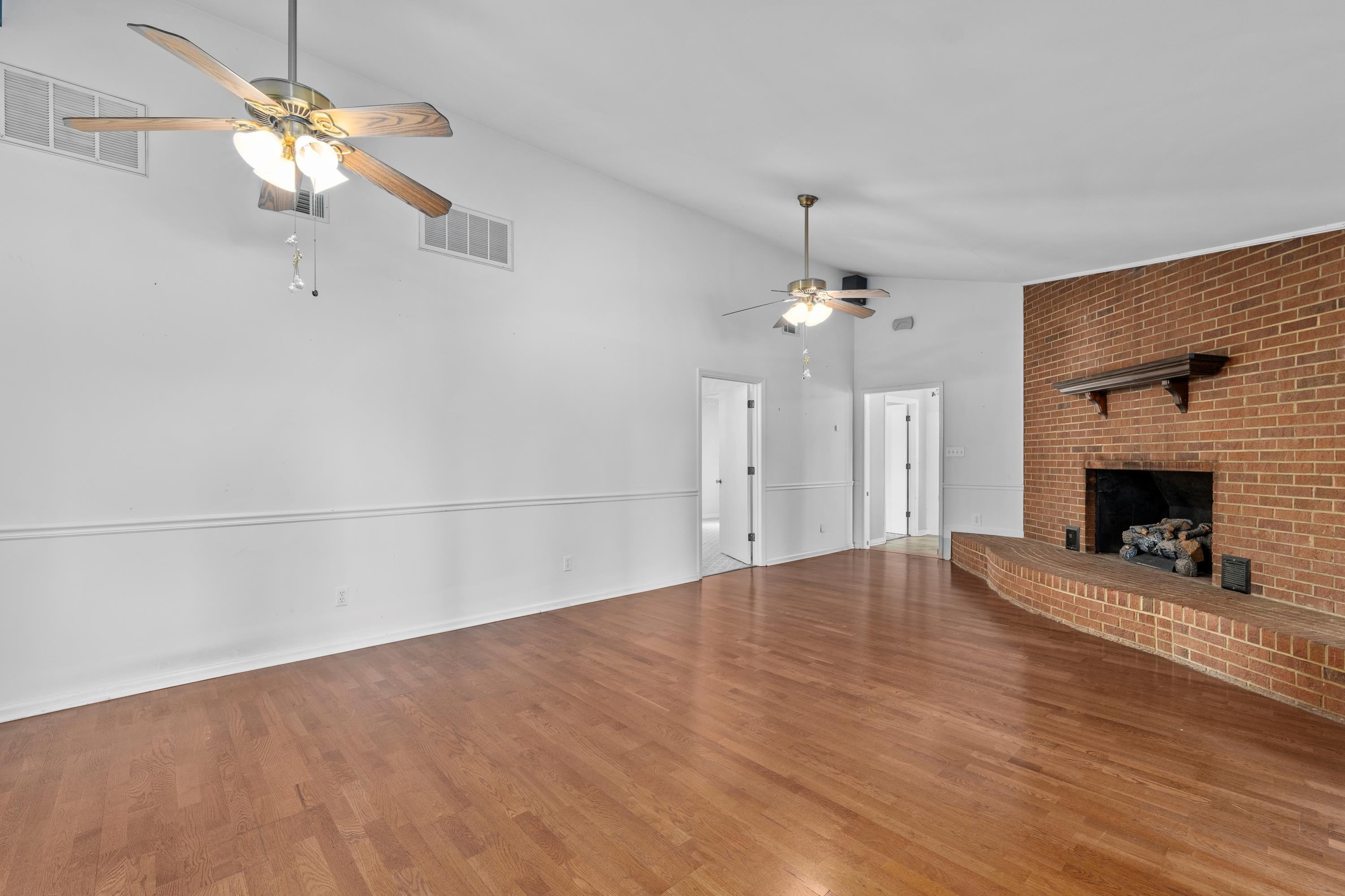 376 Louisville Road Grovetown, GA 30813 - Photo 3 of 27 Family room measures 15 x 27 with laminate floors and ceiling fans