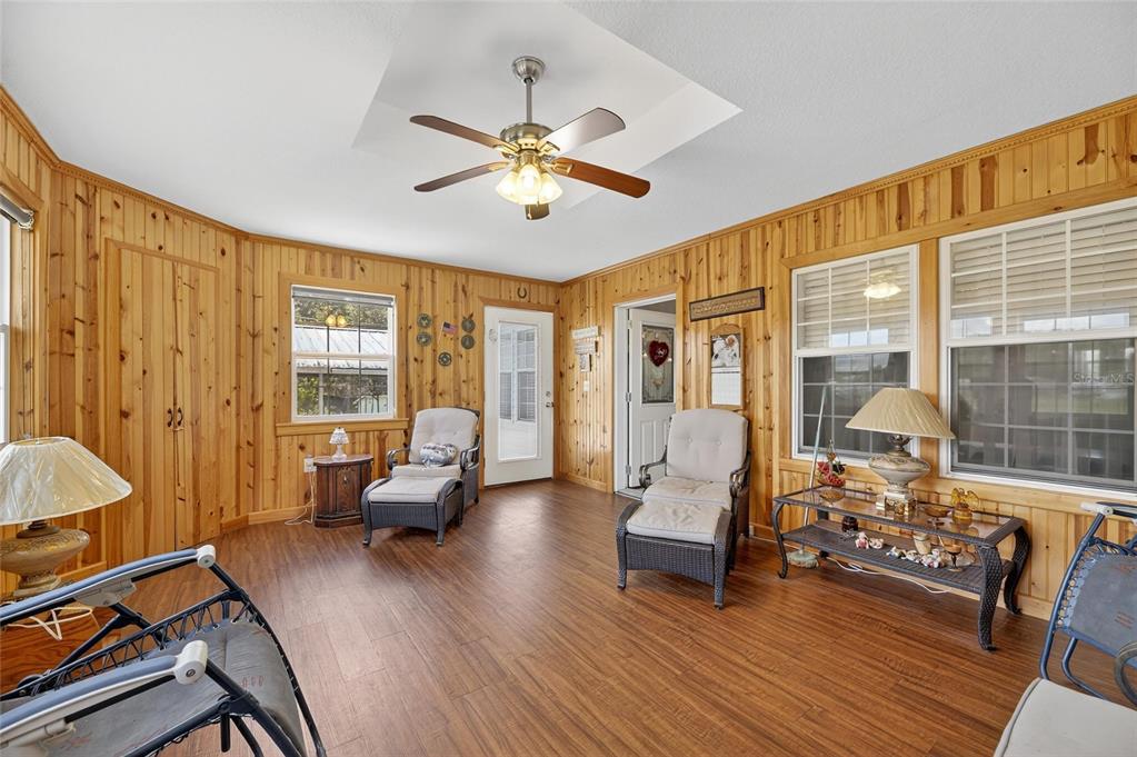 6250 Green Pond Road Polk City, FL 33868 - Photo 16 of 96 a living room with furniture and wooden floor