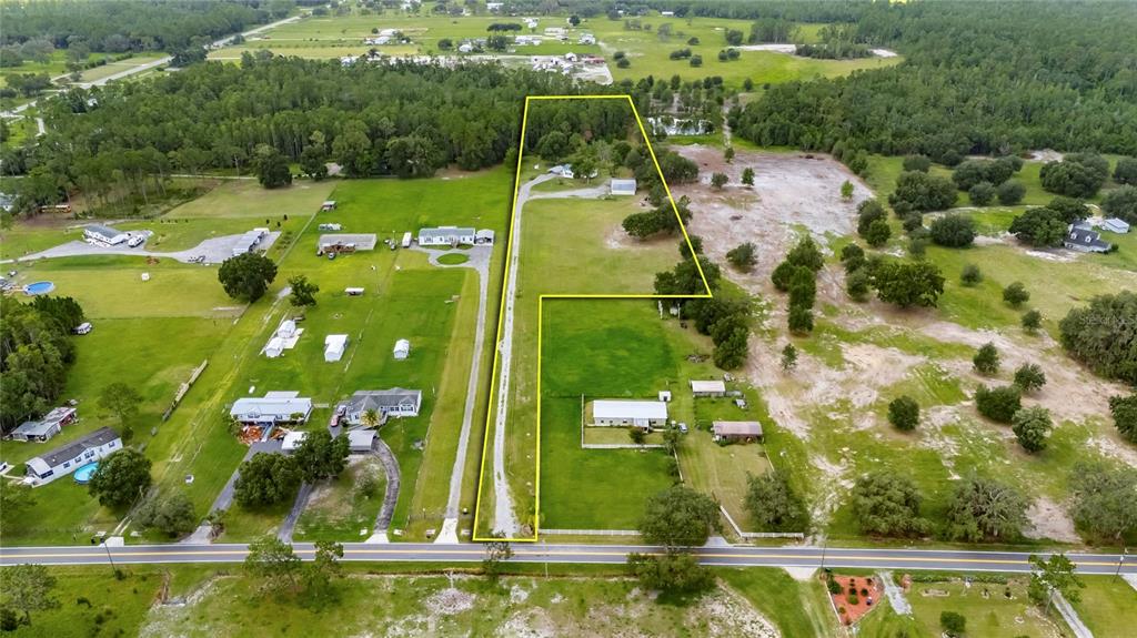 6250 Green Pond Road Polk City, FL 33868 - Photo 4 of 96 an aerial view of a residential houses with yard