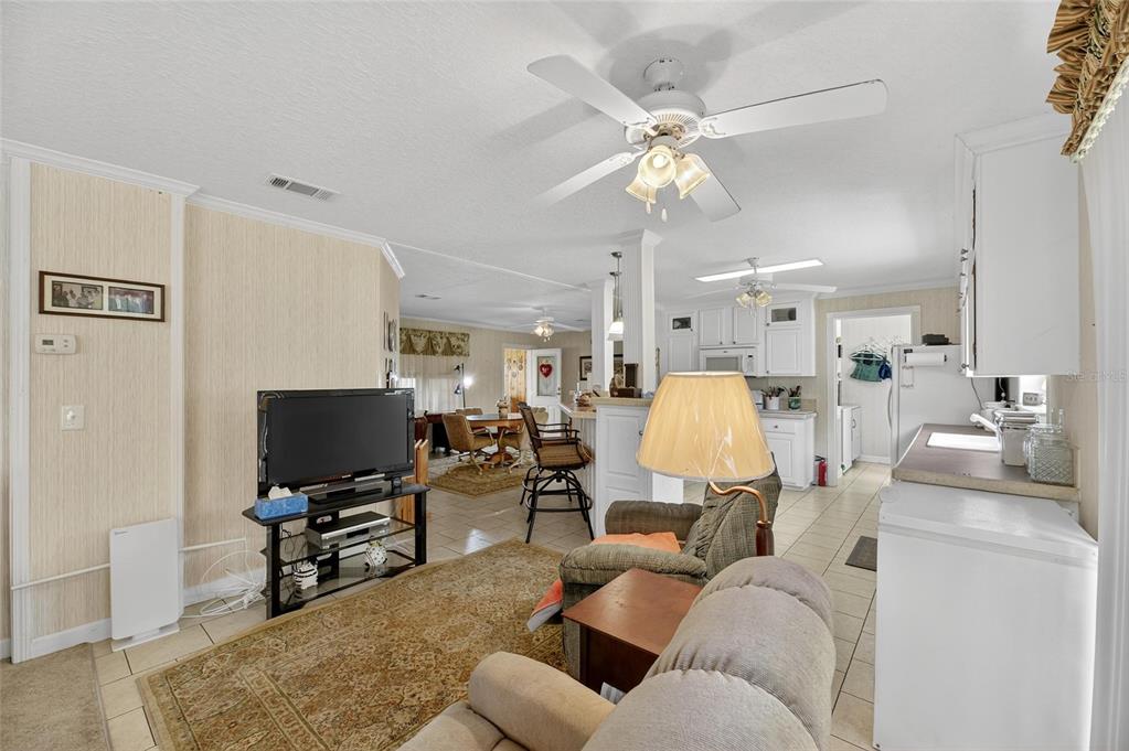6250 Green Pond Road Polk City, FL 33868 - Photo 50 of 96 a living room with furniture and a flat screen tv