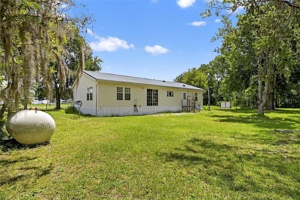 6250 Green Pond Road Polk City, FL 33868 - Photo 63 of 96 a view of a house with a backyard