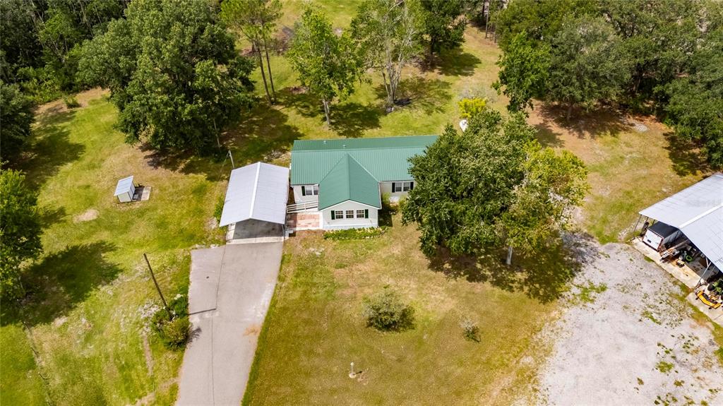 6250 Green Pond Road Polk City, FL 33868 - Photo 72 of 96 a view of a yard with swimming pool