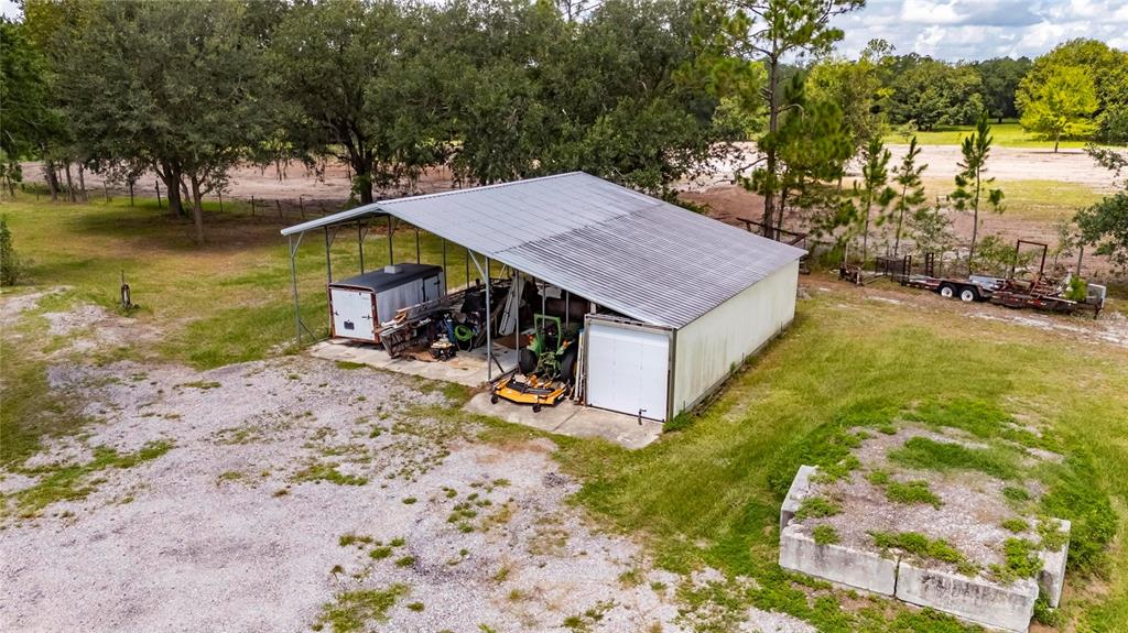 6250 Green Pond Road Polk City, FL 33868 - Photo 75 of 96 a view of a house with pool and sitting area