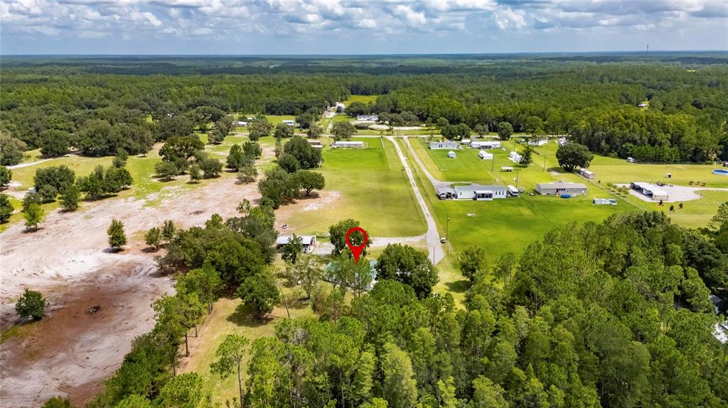 6250 Green Pond Road Polk City, FL 33868 - Photo 84 of 96 an aerial view of residential houses with outdoor space