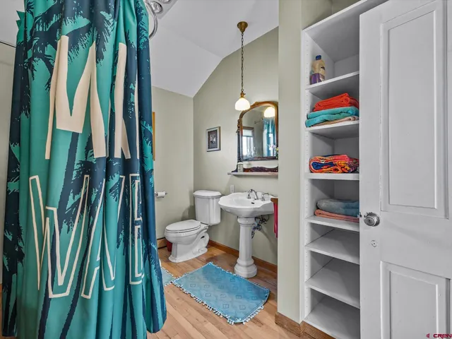 a living room filled with furniture and a book shelf
