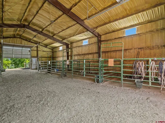 a view of empty room with wooden ceiling