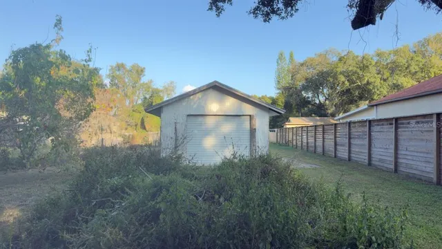a view of a backyard of the house