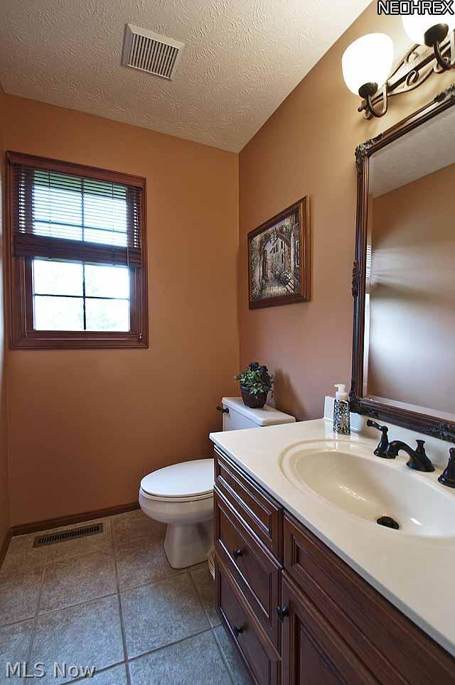 357 Longspur Road Highland Heights, OH 44143 - Photo 20 of 22 Powder Room with Cultured Marble Counters, Custom Cherry Cabinet & New Oil Rubbed Bronze Fixtures - 2011