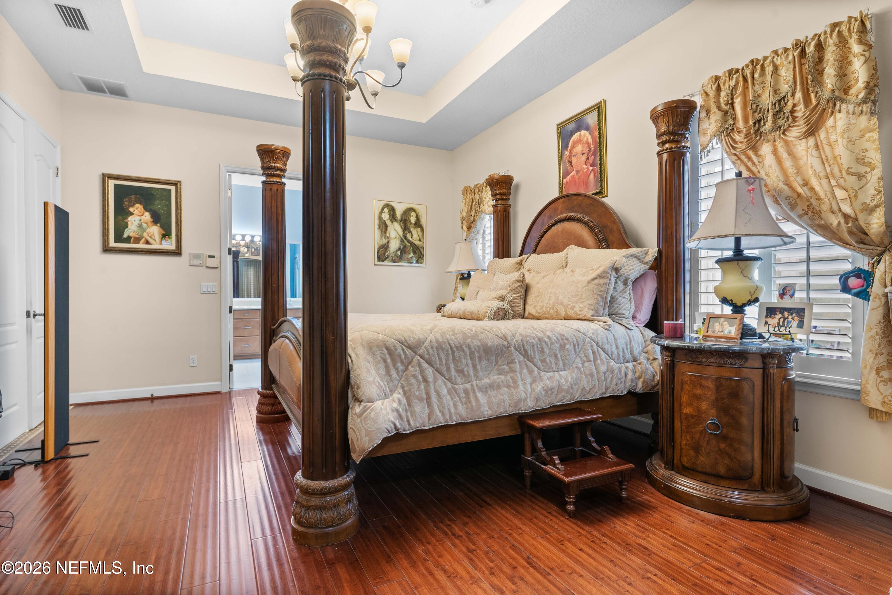 5983 Wakulla Springs Road Jacksonville, FL 32258 - Photo 17 of 31 a bedroom with a bed and a table