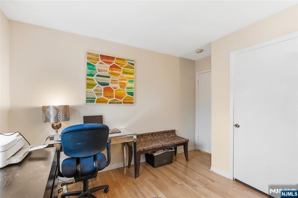 1675 Broad Street Bloomfield, NJ 07003 - Photo 16 of 35 a workspace with furniture and wooden floor
