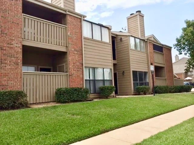 2105 Count Fleet Drive, Unit 207 Arlington, TX 76011 - Photo 1 of 17 a view of a house with a yard and a garden