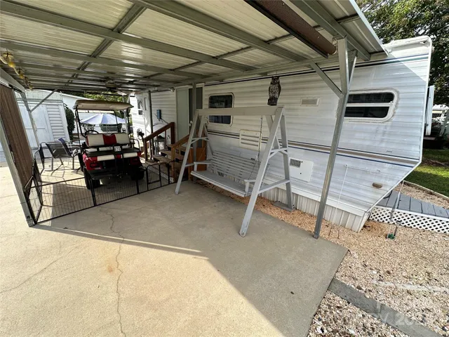 a view of a table and chairs in patio