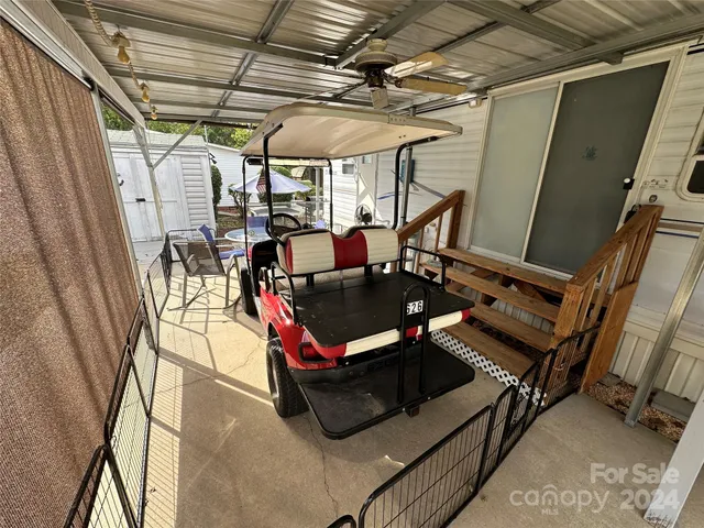 an outdoor space with furniture and garden