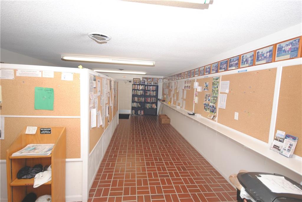 1997 Southwest Palm City Road, Unit I Stuart, FL 34994 - Photo 31 of 36 Community Bulletin Boards and Library Entrance