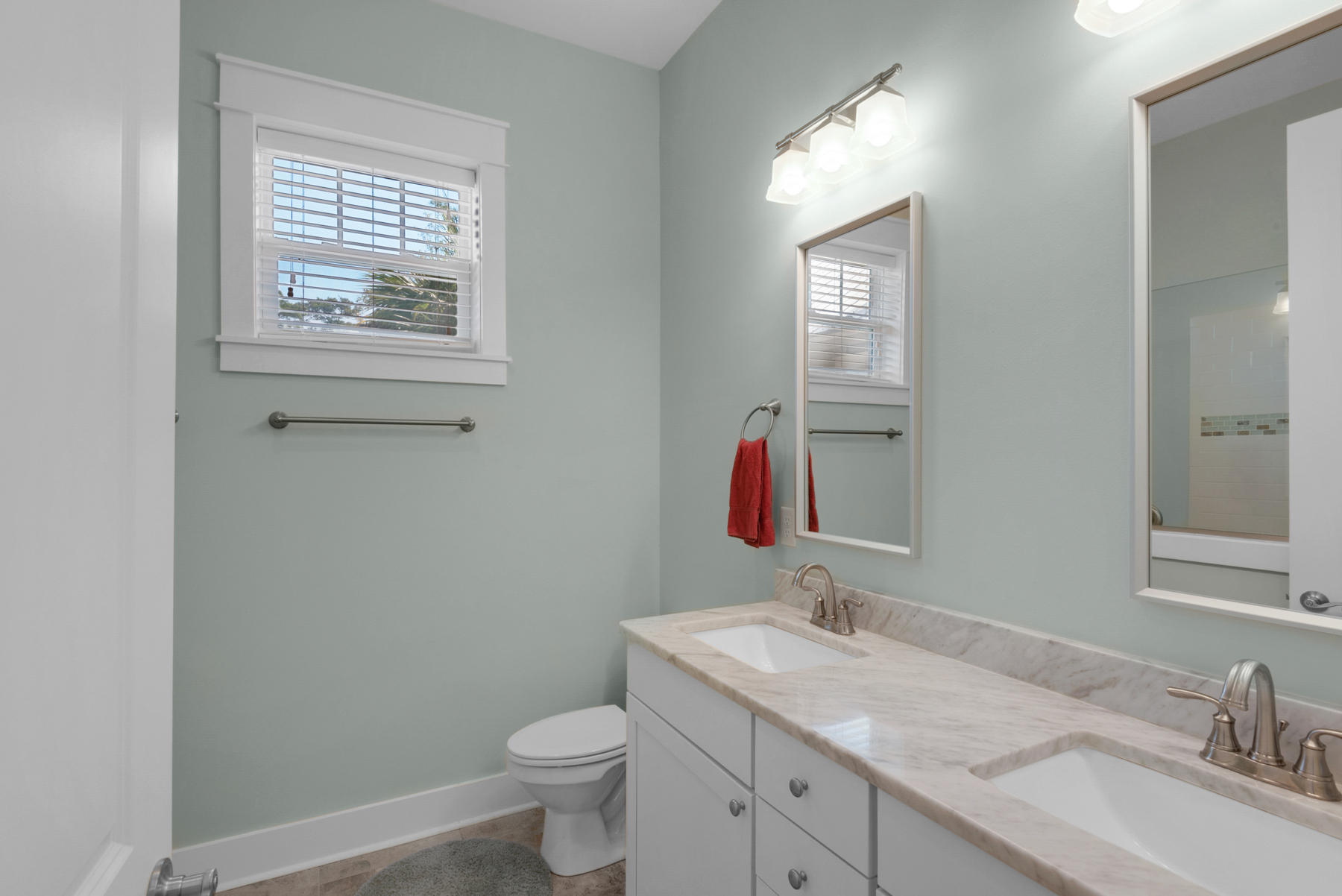 79 Greenway Park Avenue Santa Rosa Beach, FL 32459 - Photo 20 of 41 a bathroom with a granite countertop sink toilet and mirror