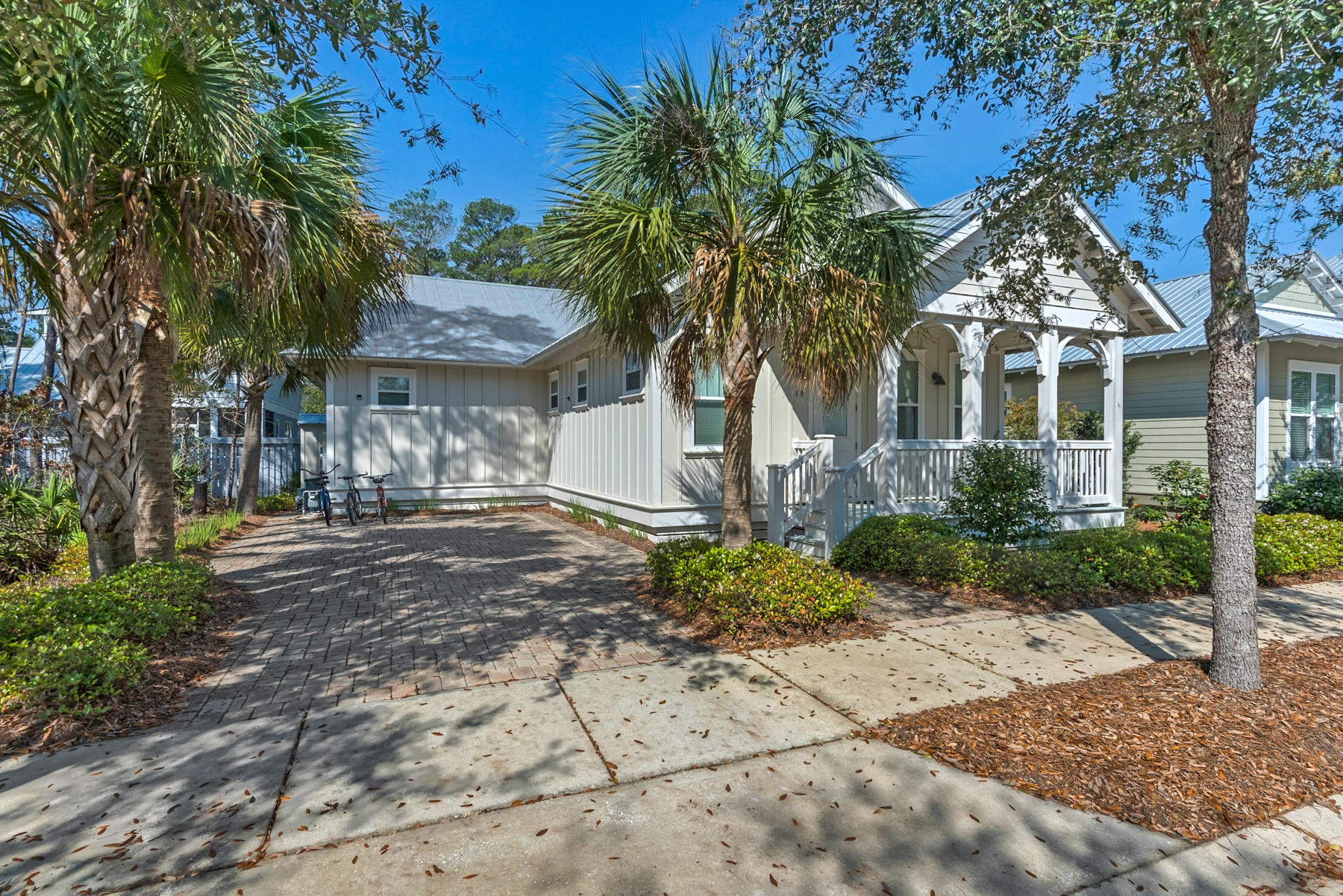 79 Greenway Park Avenue Santa Rosa Beach, FL 32459 - Photo 2 of 41 a front view of a house with garden