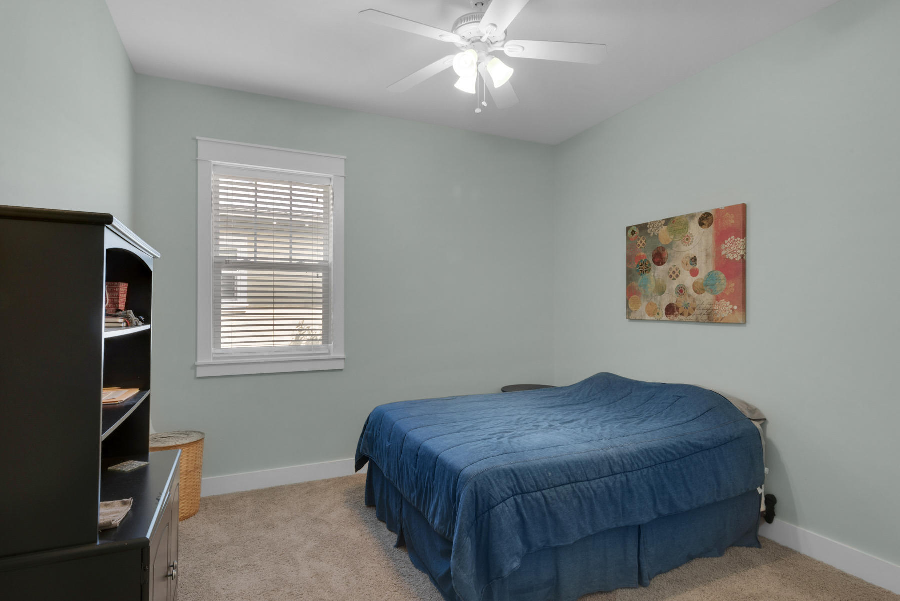 79 Greenway Park Avenue Santa Rosa Beach, FL 32459 - Photo 22 of 41 a bedroom with a bed and a chandelier