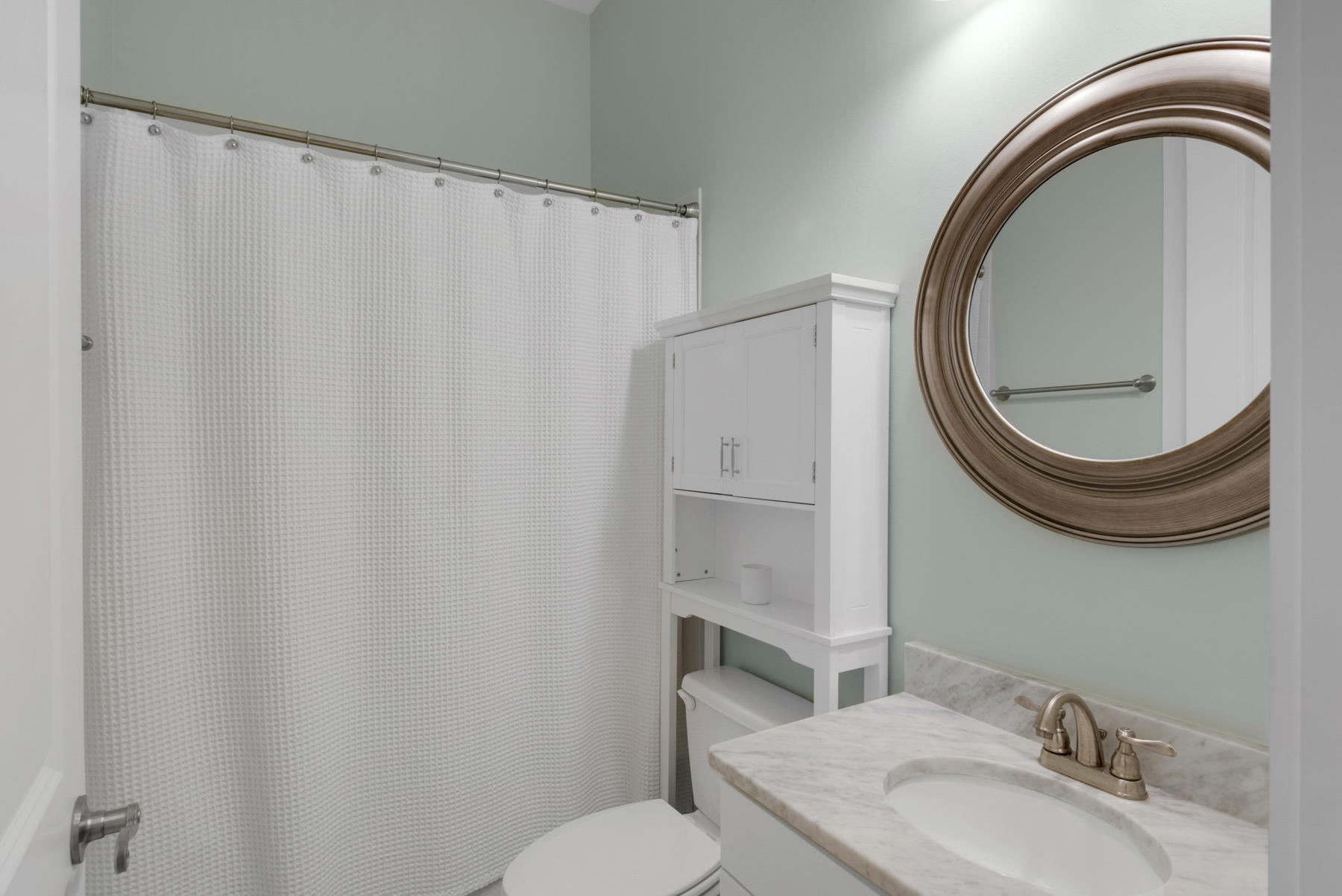 79 Greenway Park Avenue Santa Rosa Beach, FL 32459 - Photo 24 of 41 a bathroom with a granite countertop sink mirror a toilet and a mirror