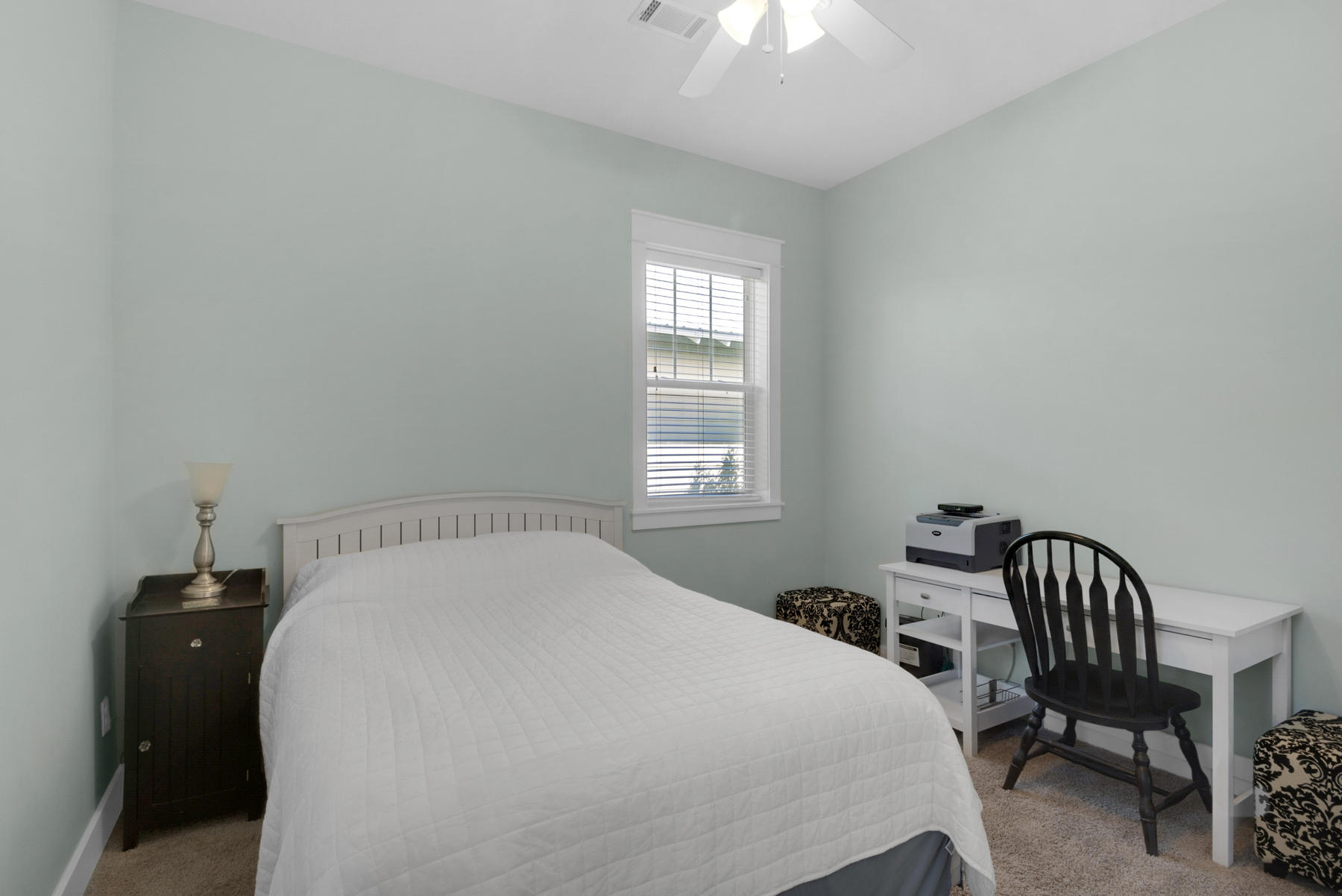 79 Greenway Park Avenue Santa Rosa Beach, FL 32459 - Photo 27 of 41 a bedroom with a bed a chandelier and a window