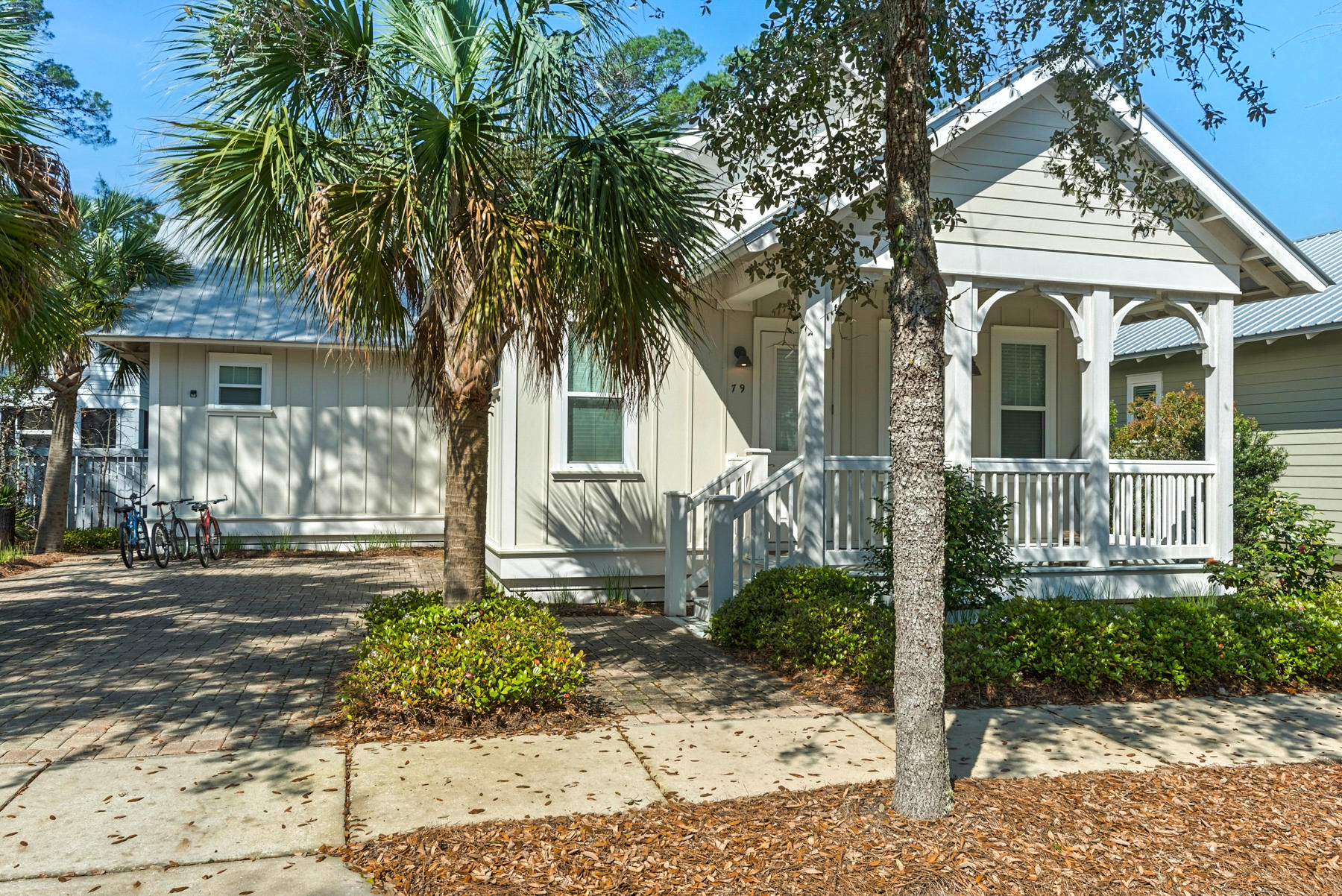 79 Greenway Park Avenue Santa Rosa Beach, FL 32459 - Photo 3 of 41 a front view of a house with garden