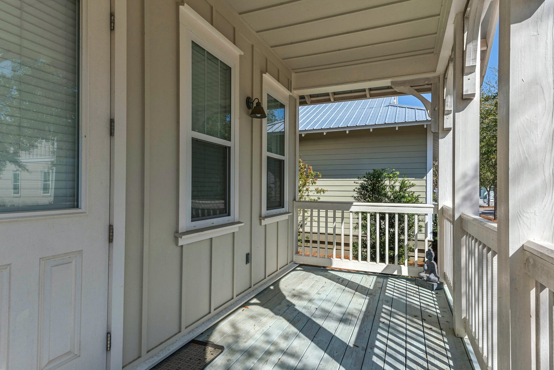 79 Greenway Park Avenue Santa Rosa Beach, FL 32459 - Photo 6 of 41 a view of a porch with a table and chair