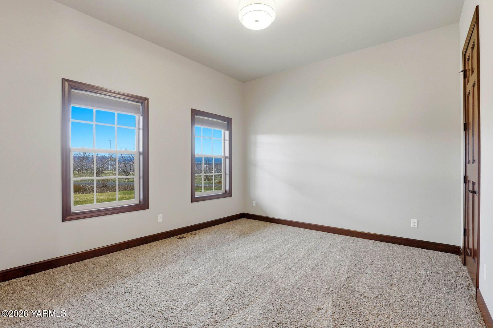 13507 West Church Road Yakima, WA 98903 - Photo 12 of 46 an empty room with windows