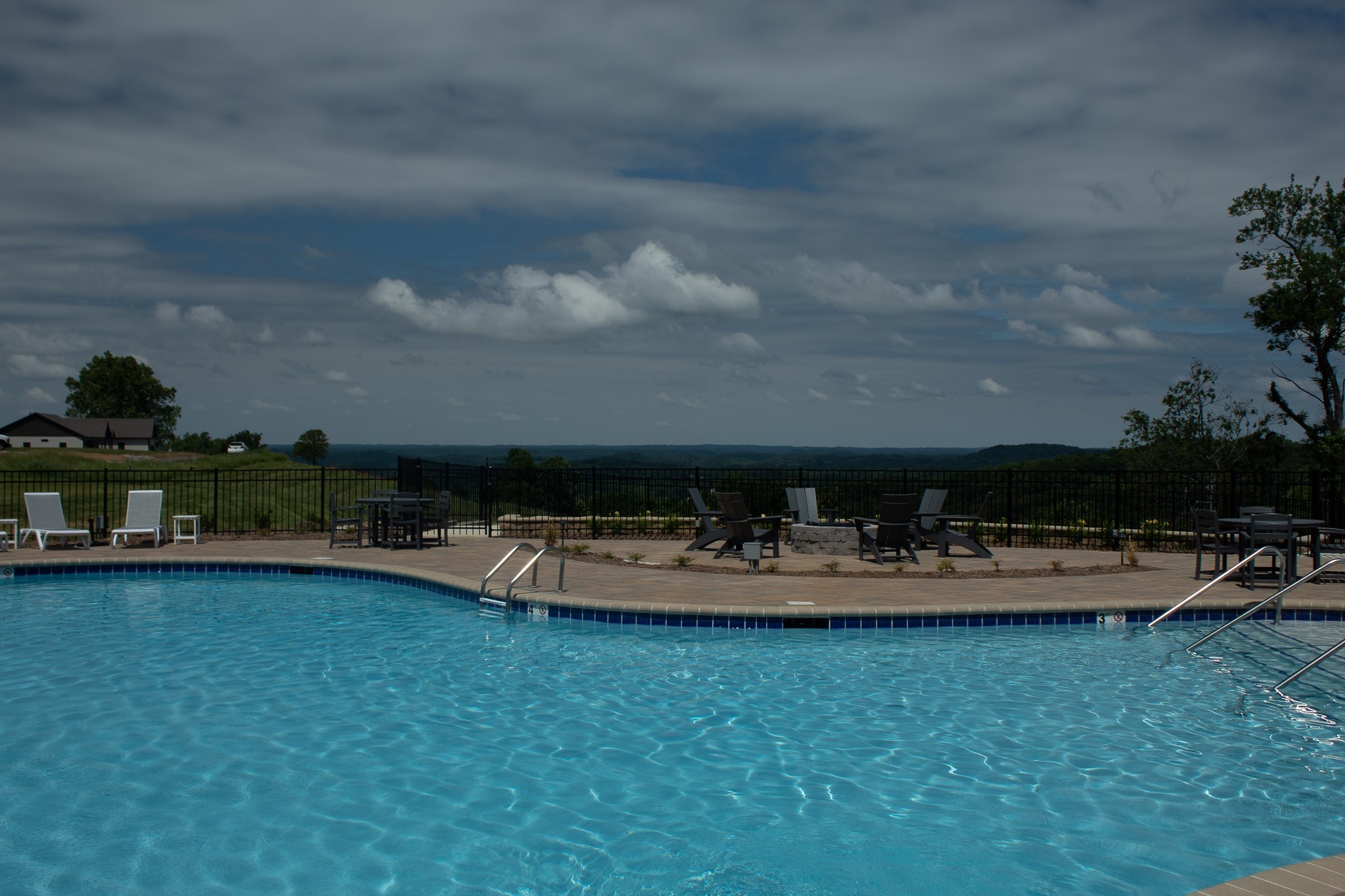 60 C Walleye Road Celina, TN 38551 - Photo 14 of 25 a view of a swimming pool with lawn chairs and plants