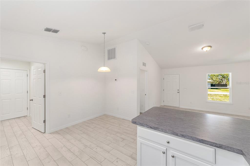 284 Southwest Commodore Road Dunnellon, FL 34431 - Photo 20 of 48 an empty room with a window and wooden floor