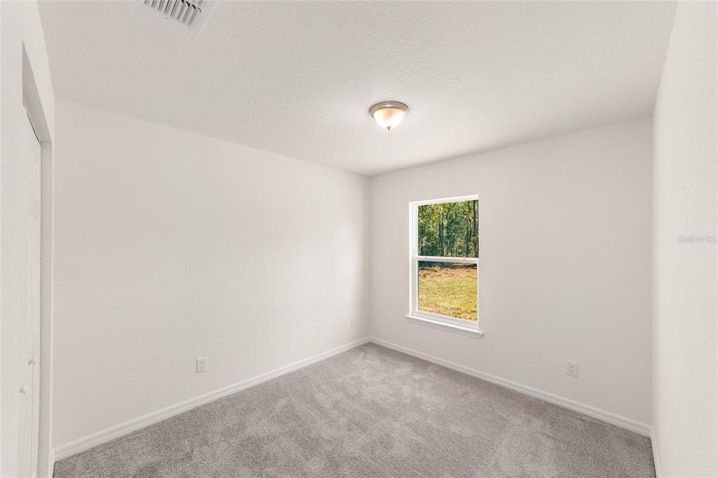 284 Southwest Commodore Road Dunnellon, FL 34431 - Photo 25 of 48 an empty room with a window