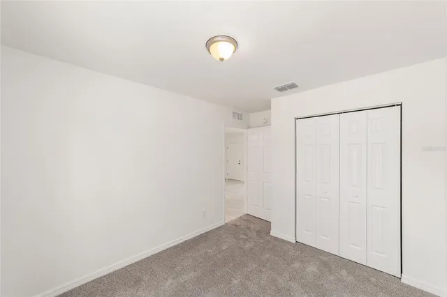 a bathroom with a bathtub shower sink mirror vanity and a toilet